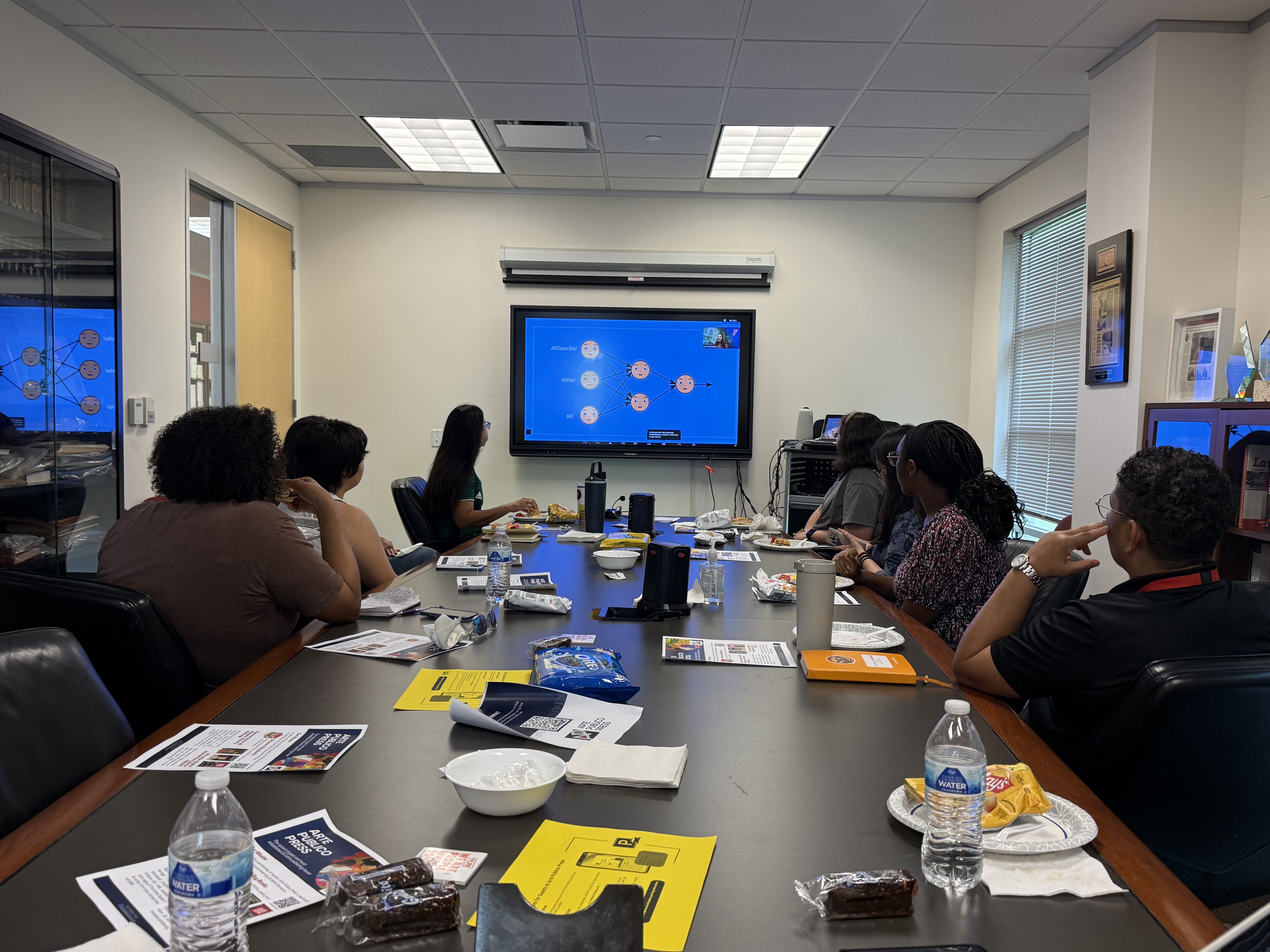 viewers looking at screen with presentation